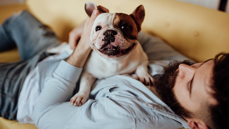 Man embracing his dog