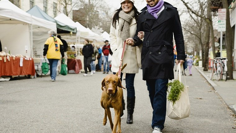 Couple with dog at farmer's market