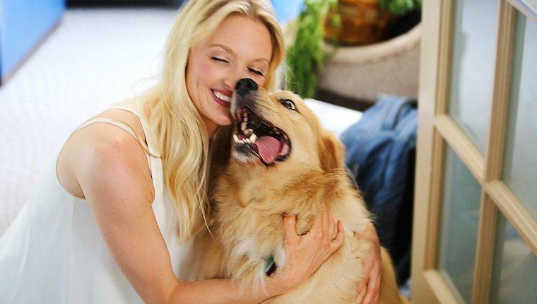 Beautiful girl with happy dog.