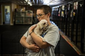 PEYTON, CO - MARCH 9: Dog Care Team member Sonja Row, holds a 11 year old Maltese male dog that arrives few days ago to the National Mill Dog Rescue seen on Friday, March 9, 2018, in Peyton, CO.
