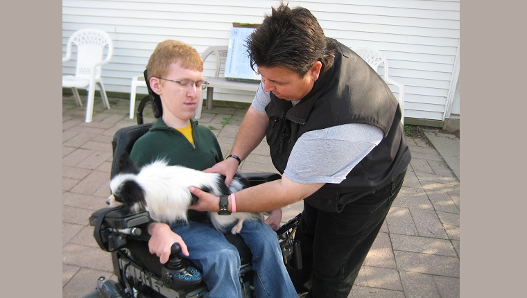 Kevin handing over Piper to trainer for initial training