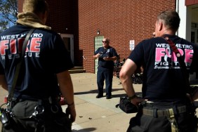 WHEAT RIDGE, CO - OCTOBER 26: Todd Rosenberger, Captain of engine 16 West Metro Fire and Rescue (center) talking to firefighters during training at Highland West Community Senior Citizens Apartments October 26, 2018 in Wheat Ridge, Colorado.