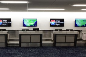 FLORIDA, UNITED STATES - JULY 7: An empty ticket counter with weather maps displayed is seen at Tampa International Airport which closed from 5:00 p.m. until 10:00 a.m as Tropical Storm Elsa moves northward toward the Tampa Bay area on July 6, 2021 in Clearwater Beach, Florida, United States. Storm is expected to make landfall on Florida's Gulf Coast as a Category 1 hurricane early Wednesday morning.