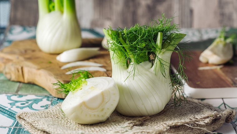 Genuine and fresh raw fennel on a rustic background