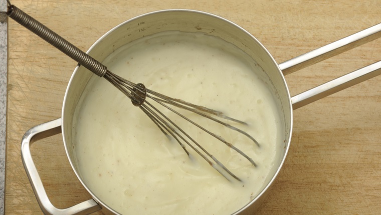 topview pan with béchamel sauce, made with butter, flower, milk and nutmeg