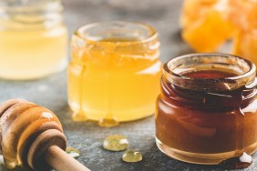 Selection of honey in small honey jars. Closeup view, toned image