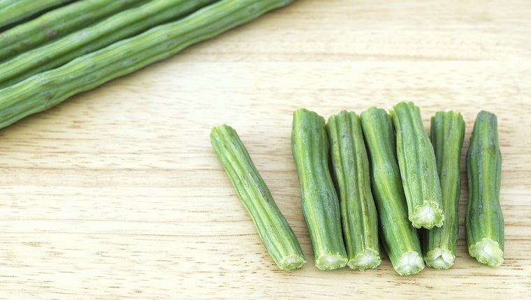 Ciut pieces of Moringa on a cutting board