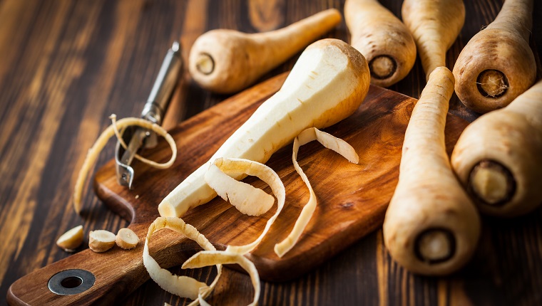 Fresh parsnip on wooden board