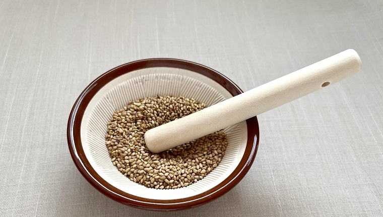 Sesame seeds in a mortar bowl