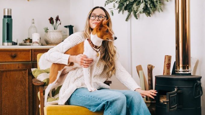 Sagittarius holding basenji