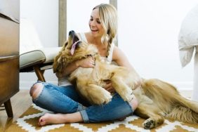 woman hugging golden retriever best dog breeds for an aquarius