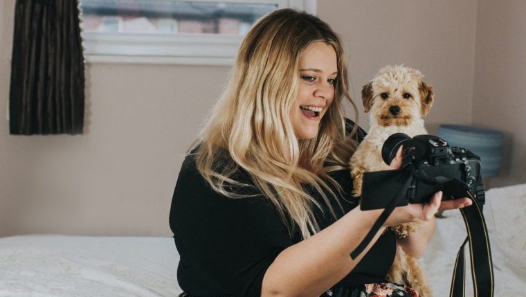 woman taking selfie with dog social media presence