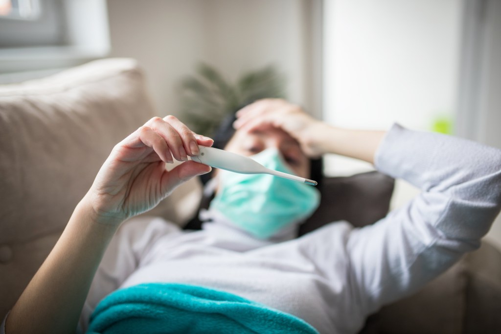 A woman suffering with flu symptoms, which are similar to the symptoms of brucellosis.