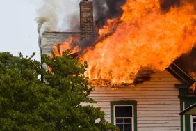 The second story and attic area of a house engulfed in flames like the Pennsylvania house fire where a dog died.