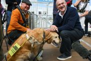 Leader of the Liberal Democrats Ed Davey meets Steve Darling, Liberal Democrat candidate for Torbay and his guide dog Jennie before going sailing with the Disabled Sailing Association at Torquay Harbour, on June 11, 2024 in Torquay, England.
