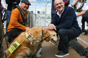 Leader of the Liberal Democrats Ed Davey meets Steve Darling, Liberal Democrat candidate for Torbay and his guide dog Jennie before going sailing with the Disabled Sailing Association at Torquay Harbour, on June 11, 2024 in Torquay, England.