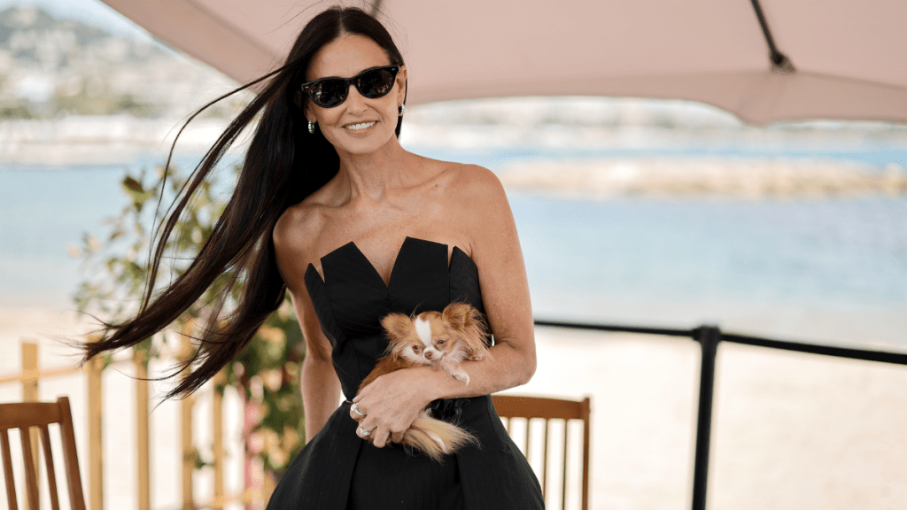 Demi Moore and her dog Pilaf attend a talk at the 77th annual Cannes Film Festival at American Pavillion on May 19, 2024 in Cannes, France.