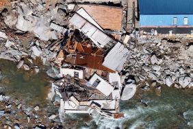 An aerial view of destroyed and damaged buildings in the aftermath of Hurricane Helene flooding, similar to the one a dog rescued a boy from, on October 8, 2024 in Bat Cave, North Carolina.