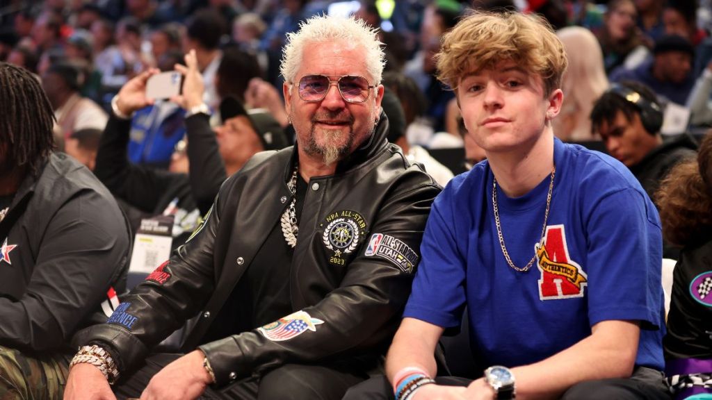 Television personality Guy Fieri poses with his son Ryder Fieri prior to the 2023 NBA All Star Game between Team Giannis and Team LeBron at Vivint Arena on February 19, 2023 in Salt Lake City, Utah.