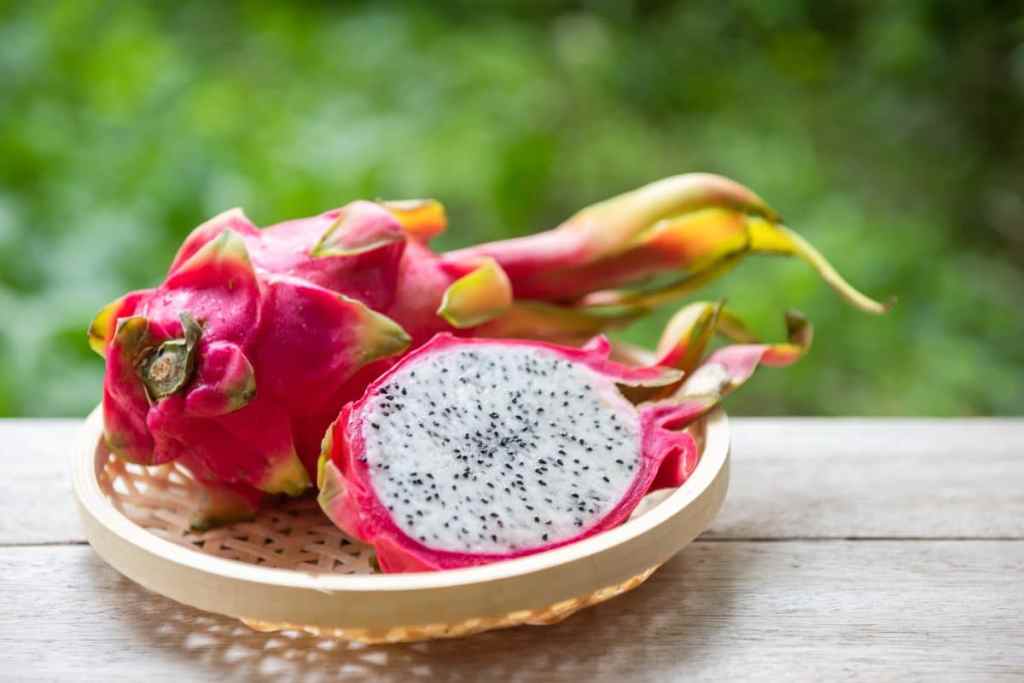 Pitaya or Dragon Fruit on a straw plate.